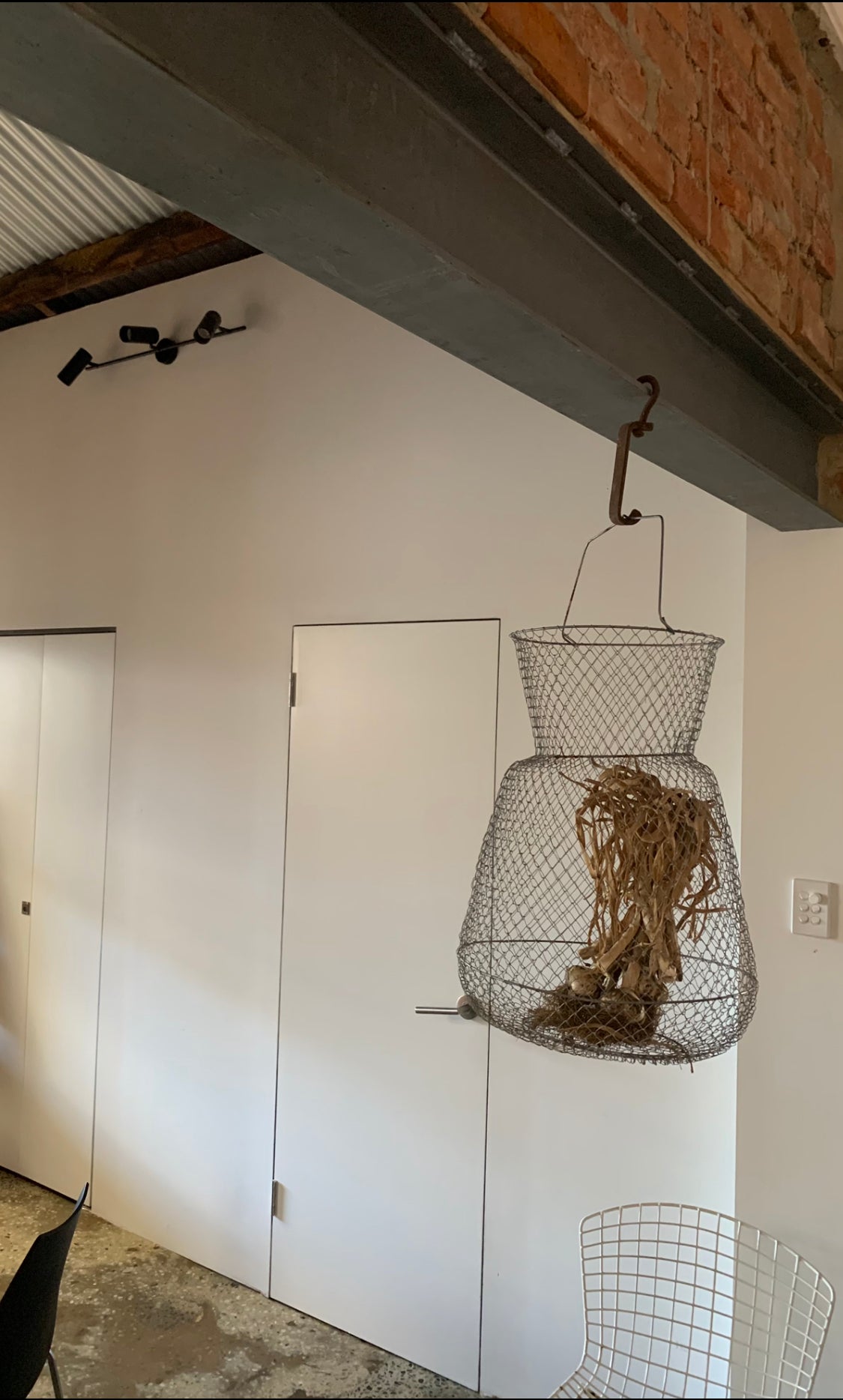 Hanging vintage mesh minnow trap